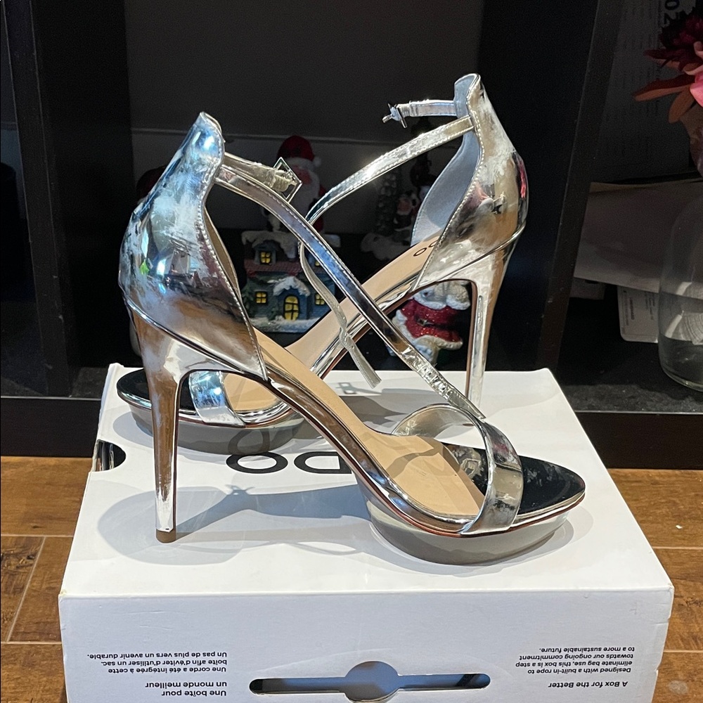 Aldo Metallic Silver Heels. Worn once, no wear and tear. Some discolouration.